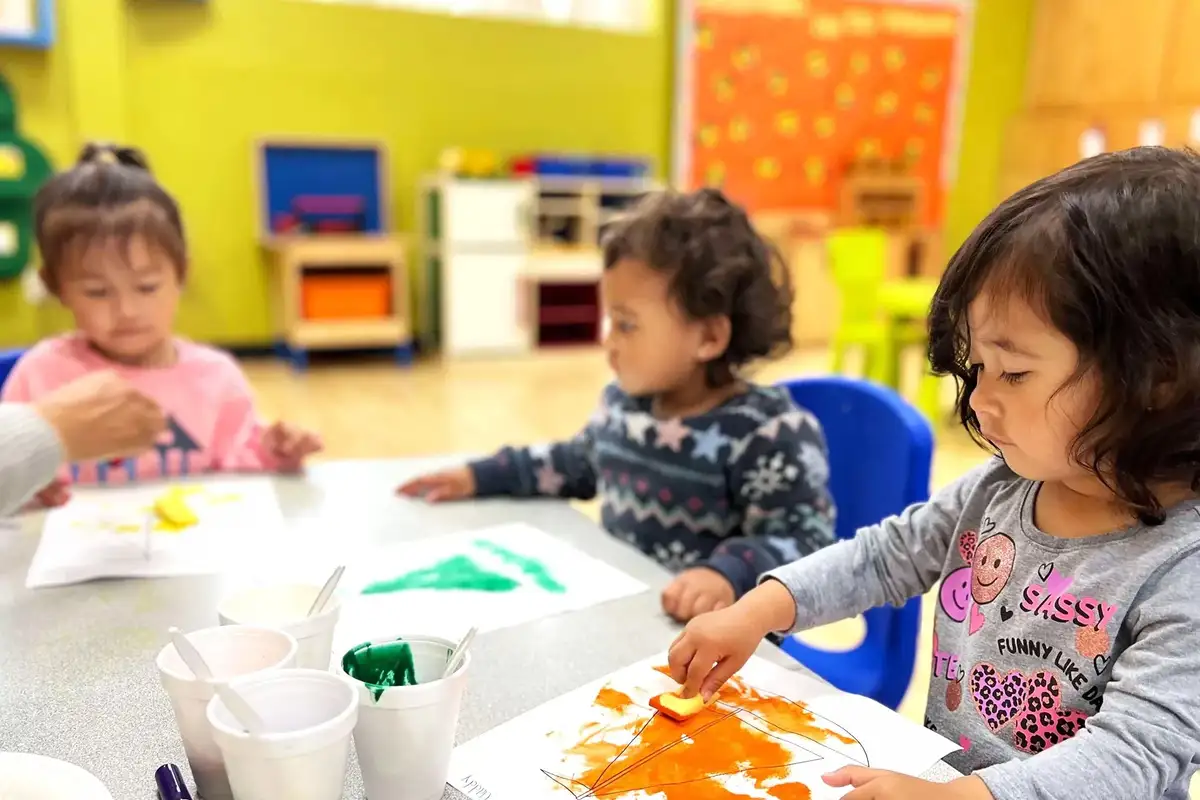 Children learning language, literacy, and creative arts through Montessori-inspired materials and hands-on discovery…