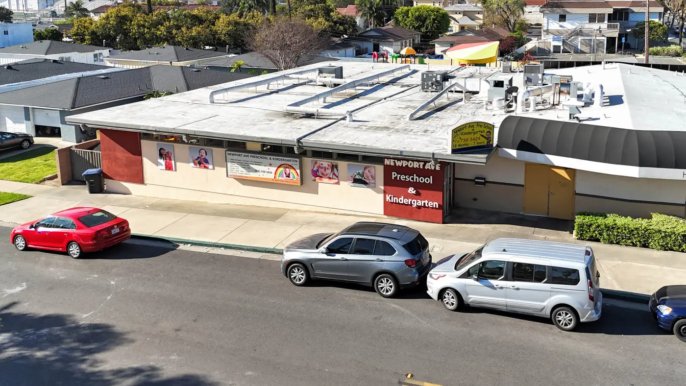 Aerial drone view of Newport Ave Preschool in Tustin, serving Santa Ana families, with the school name visible