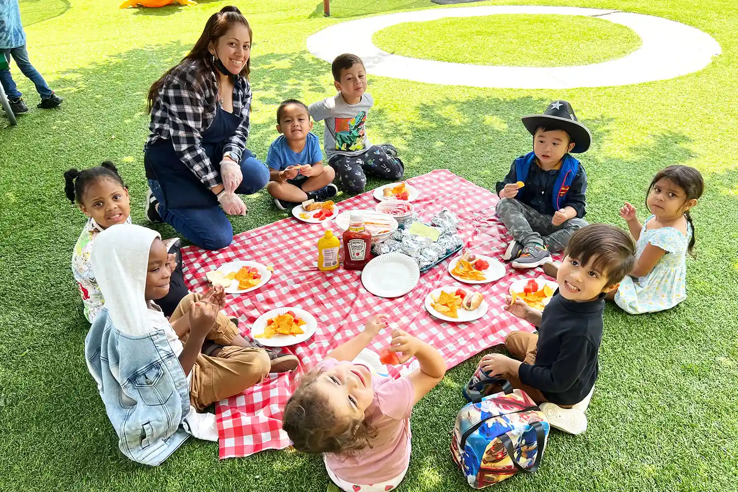 Children enjoying outdoor summer play at Newport Ave Preschool