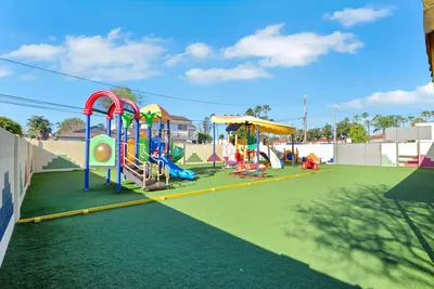 Safe outdoor playground with age-appropriate play structures and secured play centers at Newport Ave Preschool