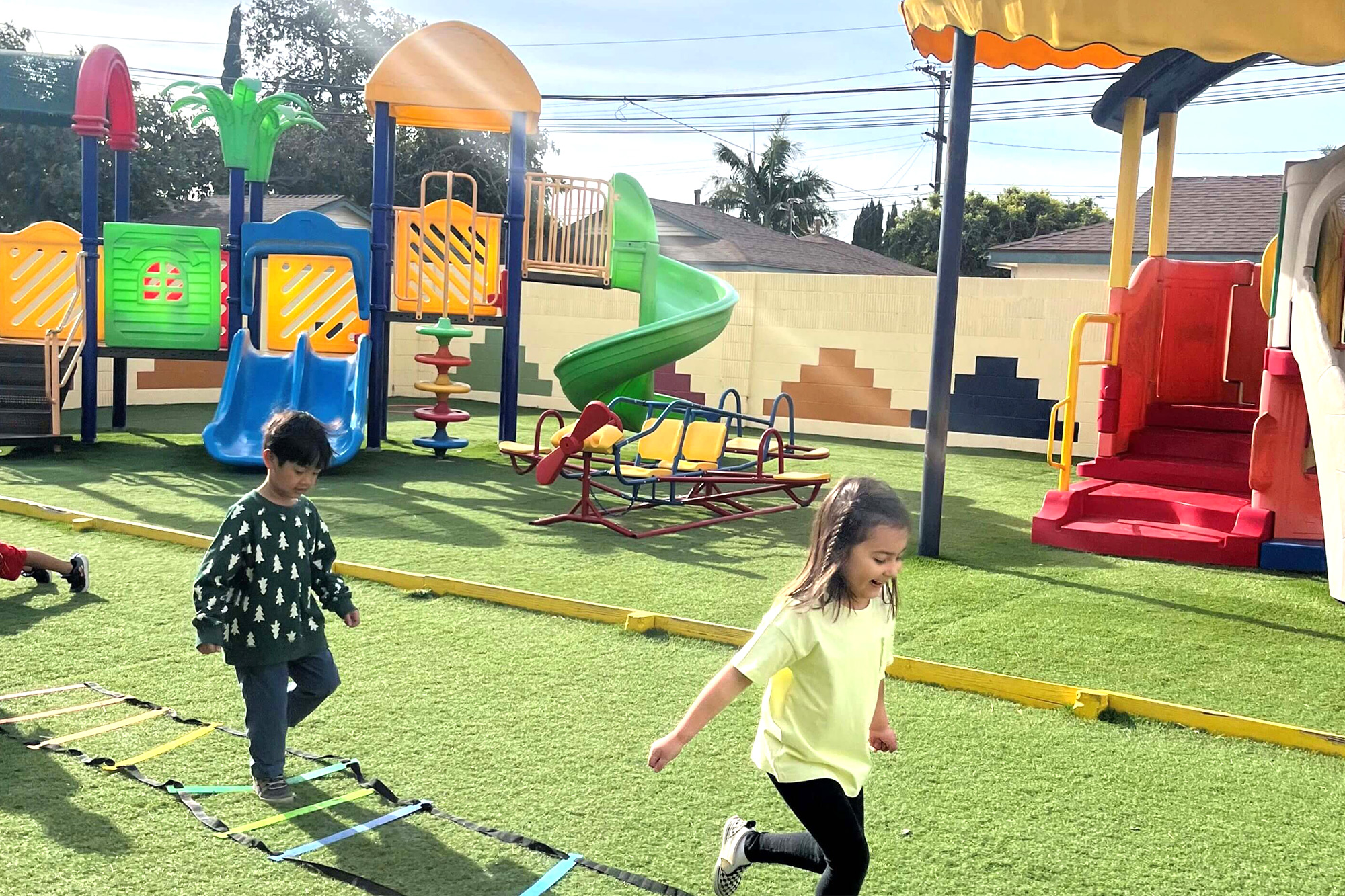 Outdoor play area facility at Newport Ave Preschool with safe and fun equipment