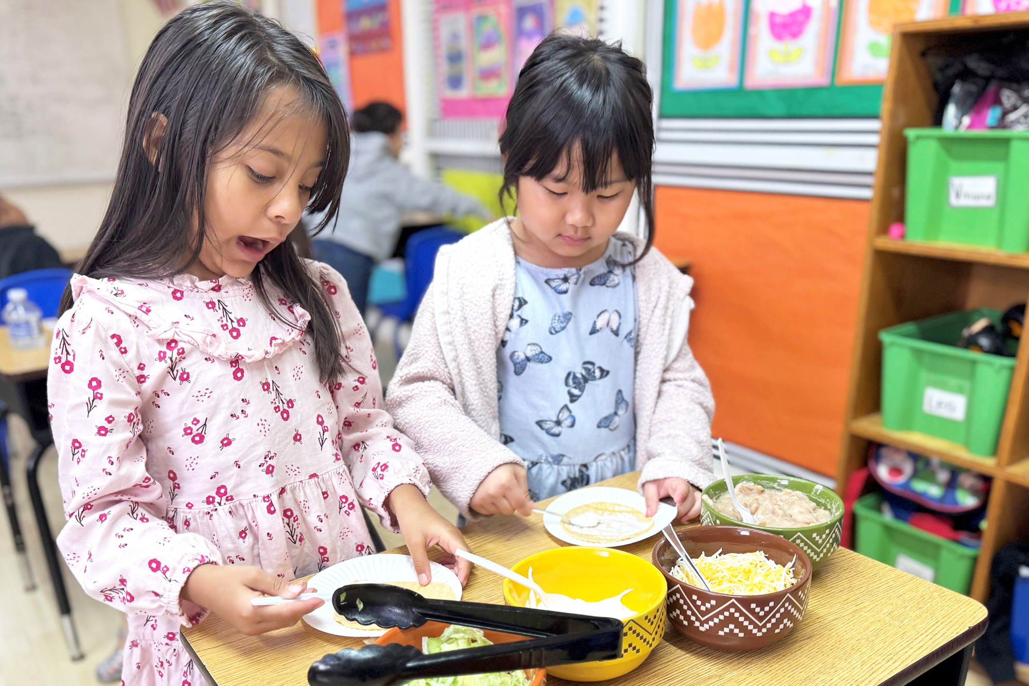 Children enjoying Santa Ana Montessori Monthly Activities in the classroom